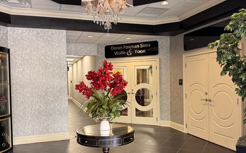 Lobby atrium with an octagonal ceiling, chandelier and tenant suite doors